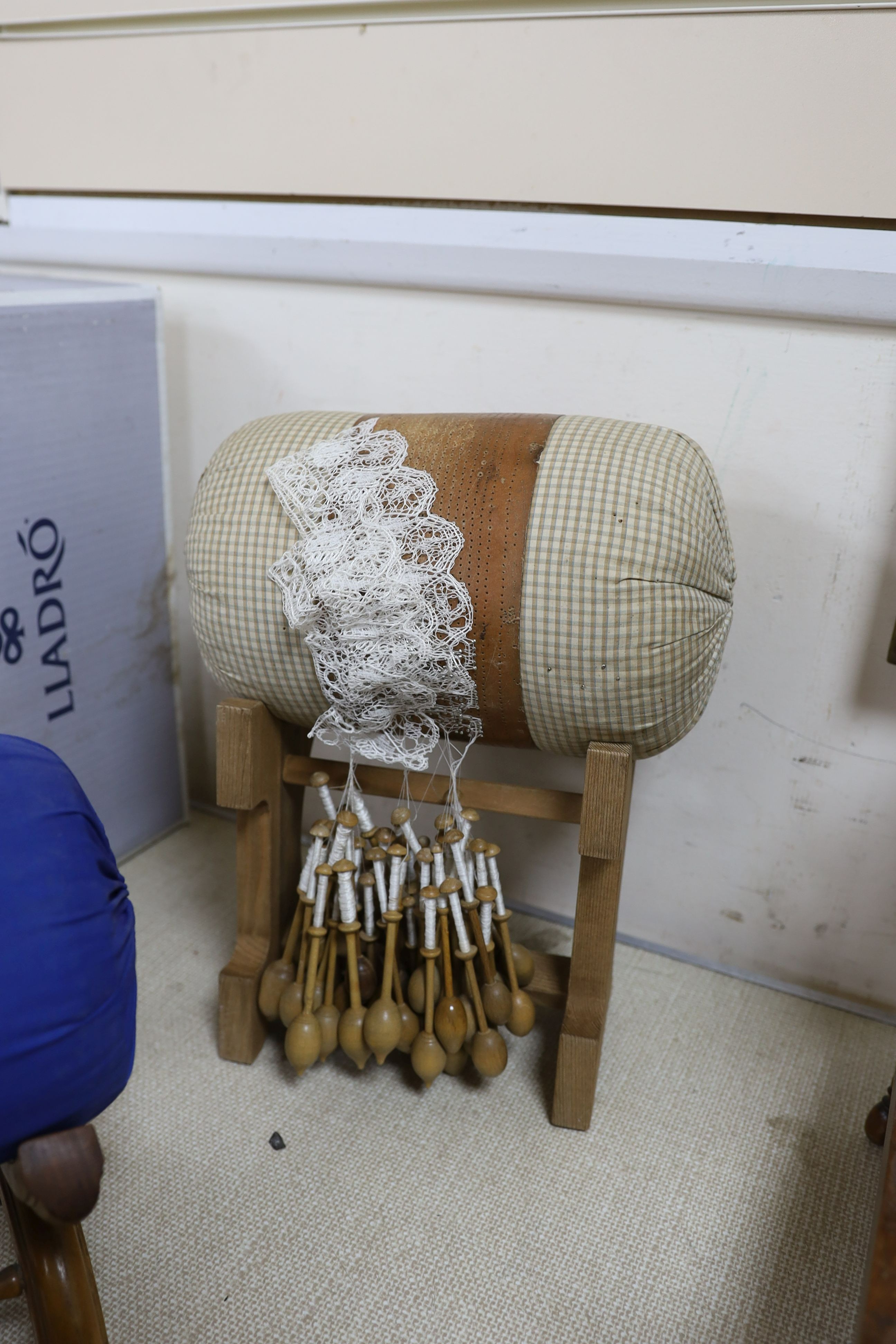 Two model lace-bobbin wheels, lace-maker’s pillows, bobbins, pillows etc